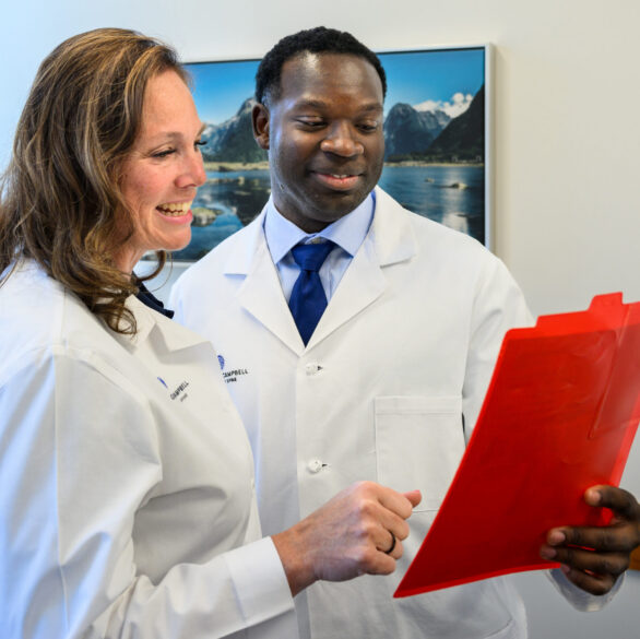 Avon Physicians Reviewing a patient chart